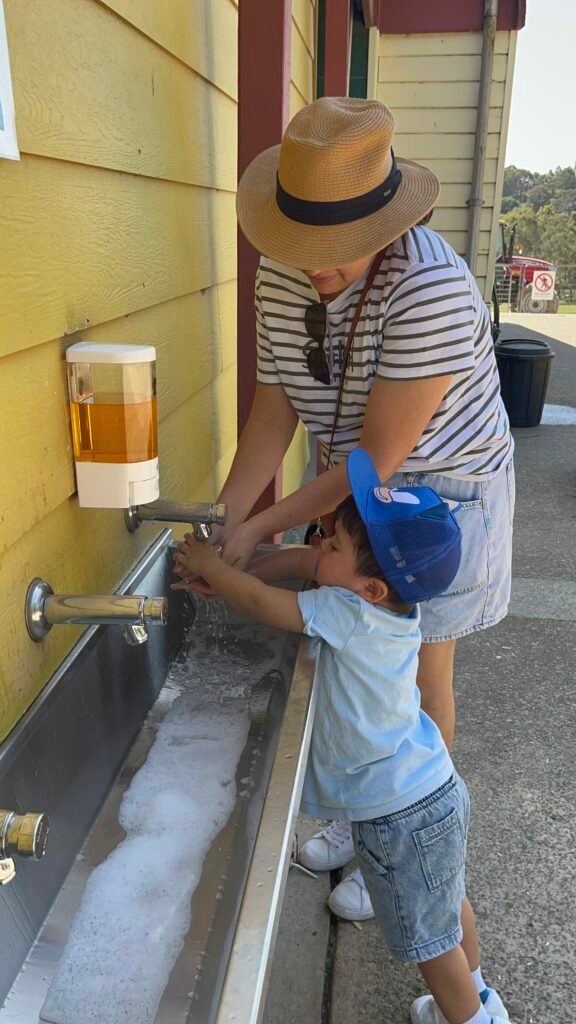 Benji washing his hands at the washing station