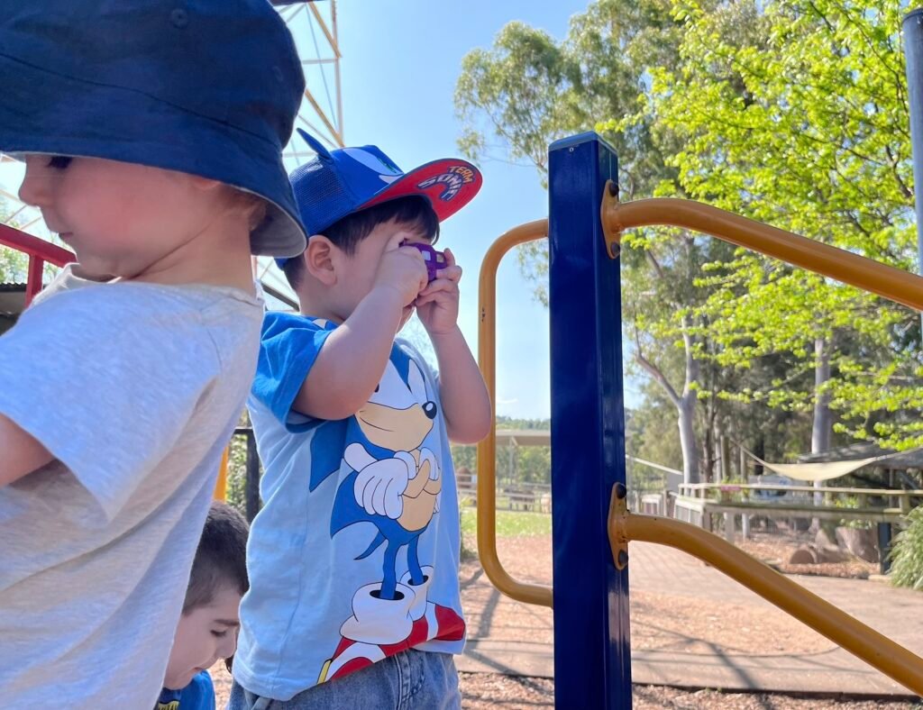 Benji taking photos in the playground